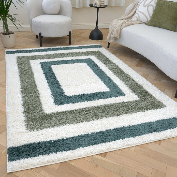 Moodi Shaggy Green Rug, Bordered design, underfloor heating | THE RUGS