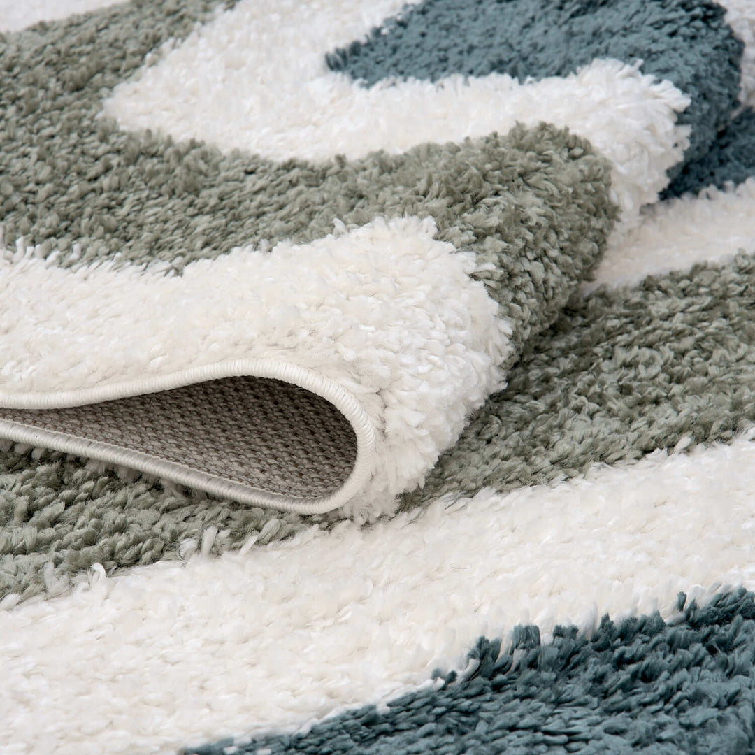 Moodi Shaggy Green Rug, Bordered design, underfloor heating | THE RUGS
