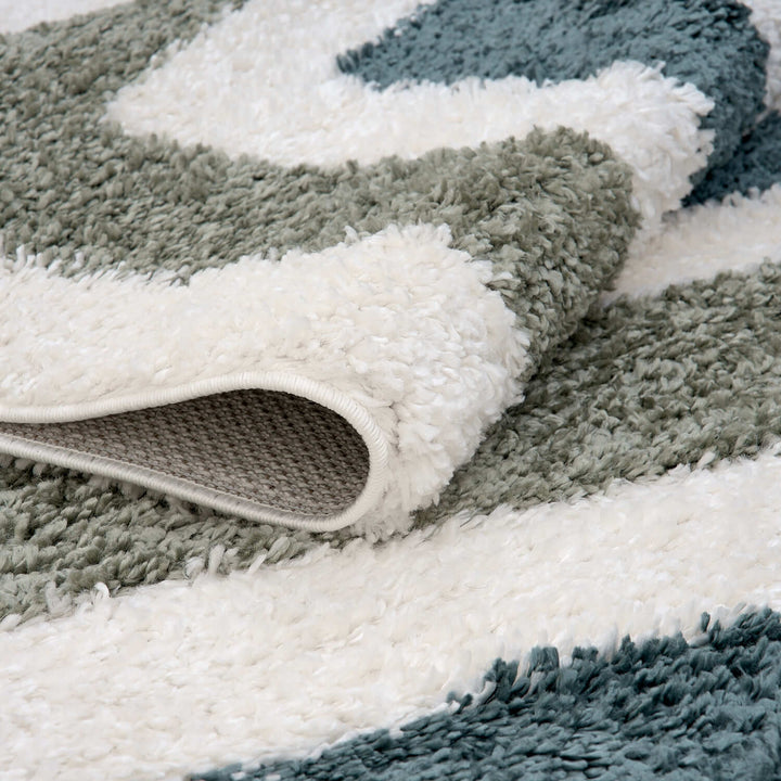 Moodi Shaggy Green Rug, Bordered design, underfloor heating | THE RUGS