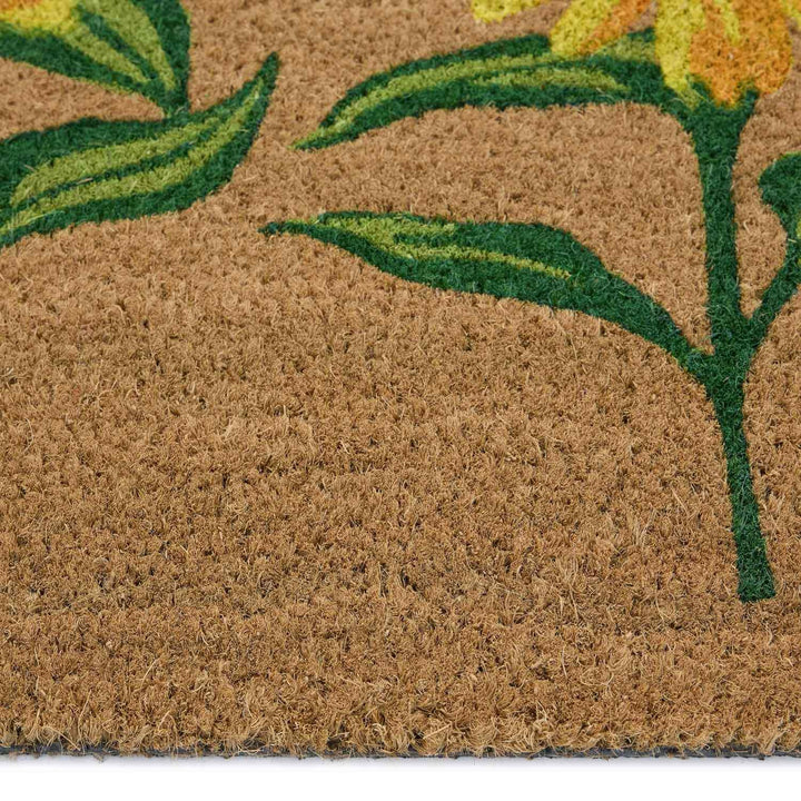 Doormat with floral design featuring yellow flowers and green leaves on a brown background