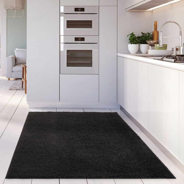 Black shaggy Rug Plain design thick pile, high quality, soft & durable.