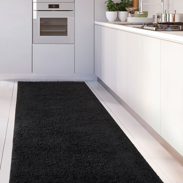 Black shaggy Rug Plain design thick pile, high quality, soft & durable.