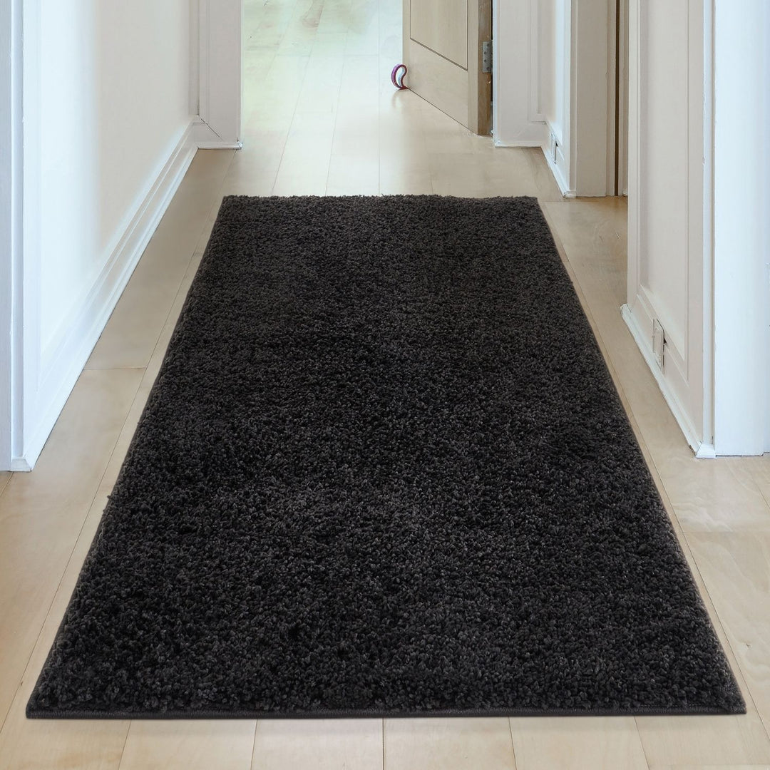Black shaggy Rug Plain design thick pile, high quality, soft & durable.