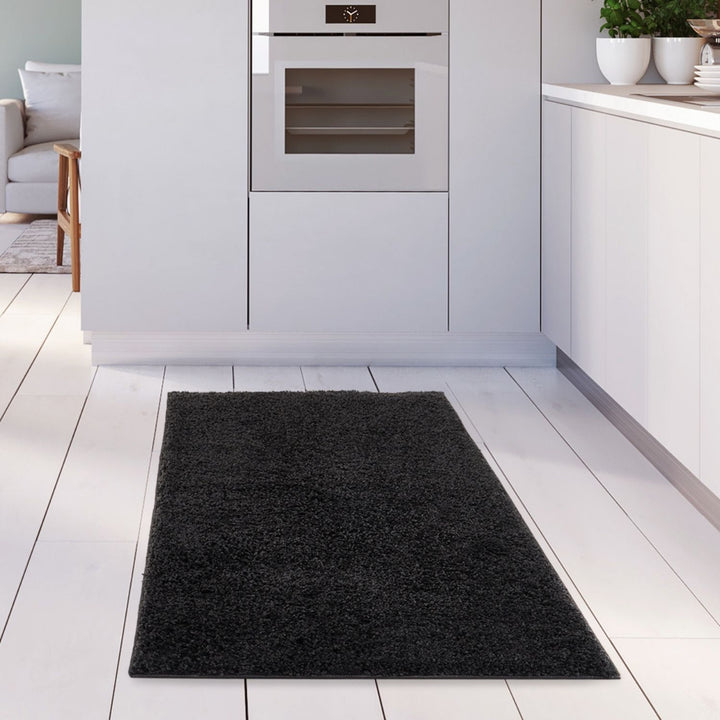 Black shaggy Rug Plain design thick pile, high quality, soft & durable.