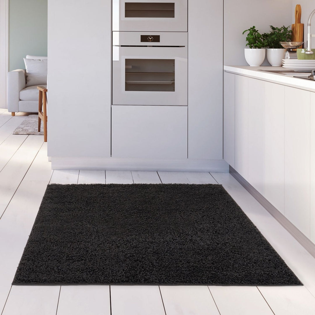 Black shaggy Rug Plain design thick pile, high quality, soft & durable.