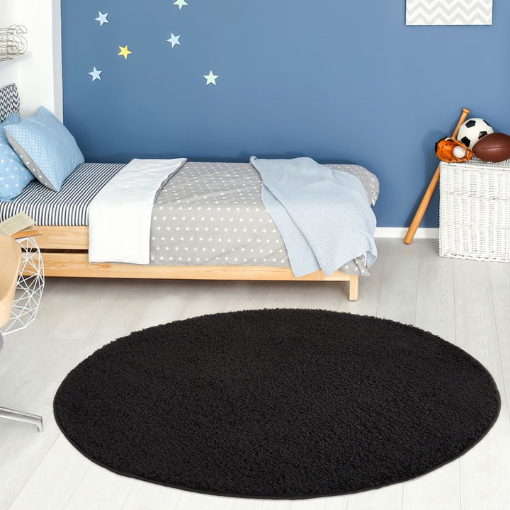 Black shaggy Rug Plain design thick pile, high quality, soft & durable.
