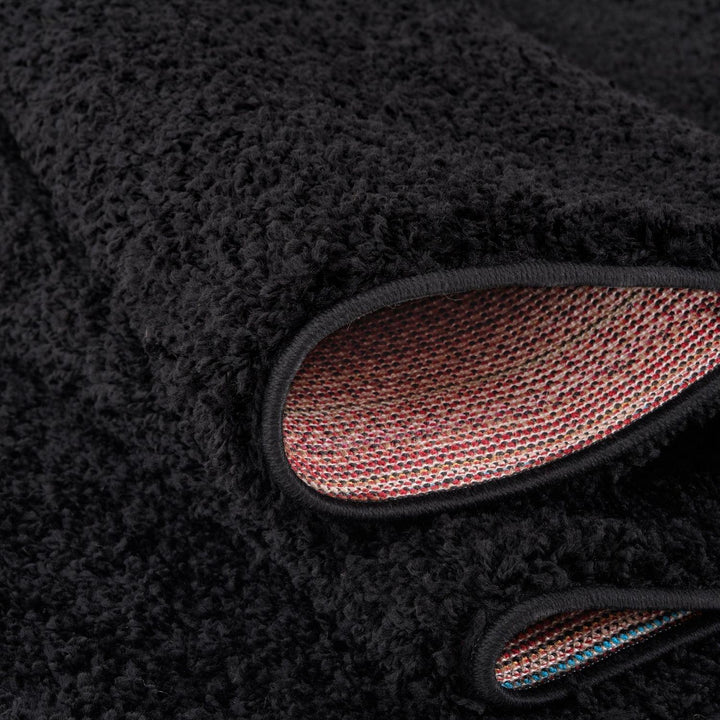 Black shaggy Rug Plain design thick pile, high quality, soft & durable.