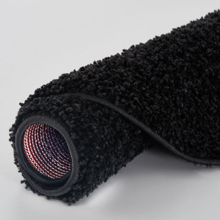 Black shaggy Rug Plain design thick pile, high quality, soft & durable.