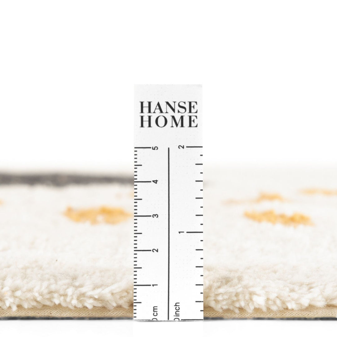 Hanse Home rug with a ruler for scale on a white background