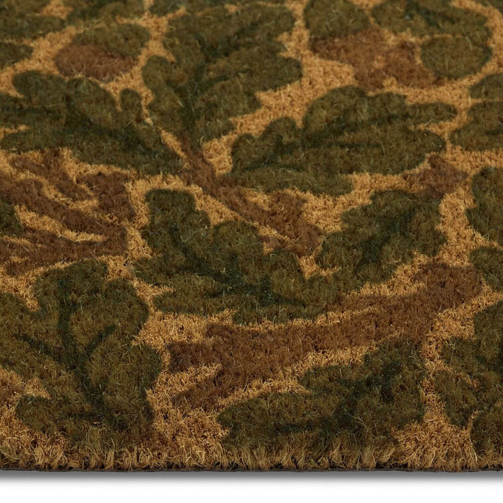 Close-up of a textured doormat with leaf pattern