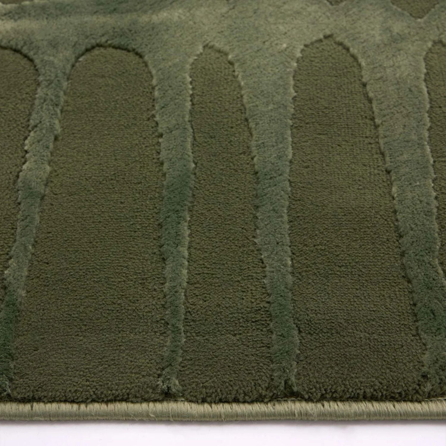 Close-up of a green textured patch on a white background
