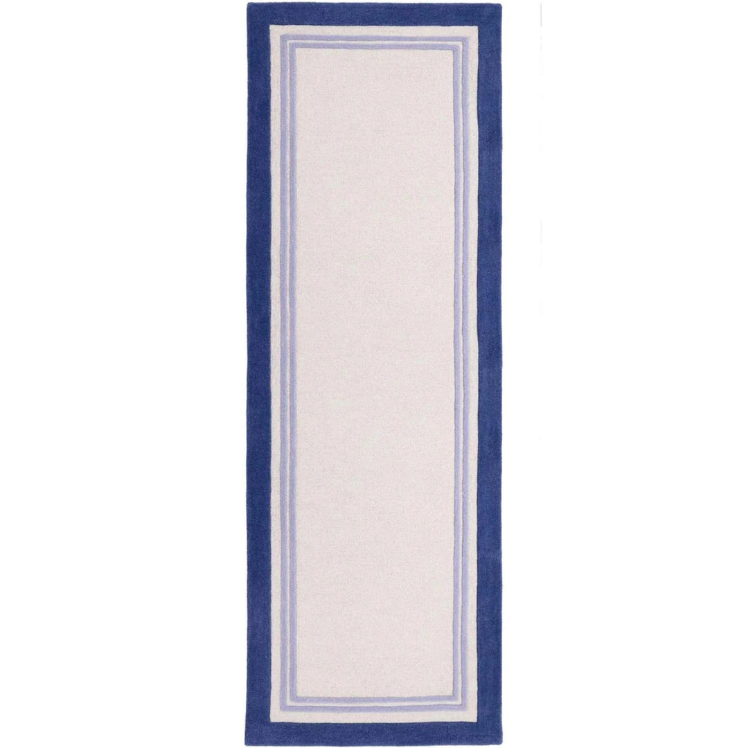 Rectangular rug with blue border on a white background