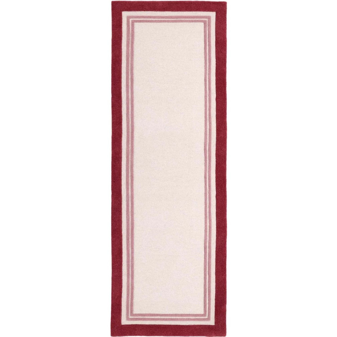 Rectangular rug with a red border on a white background