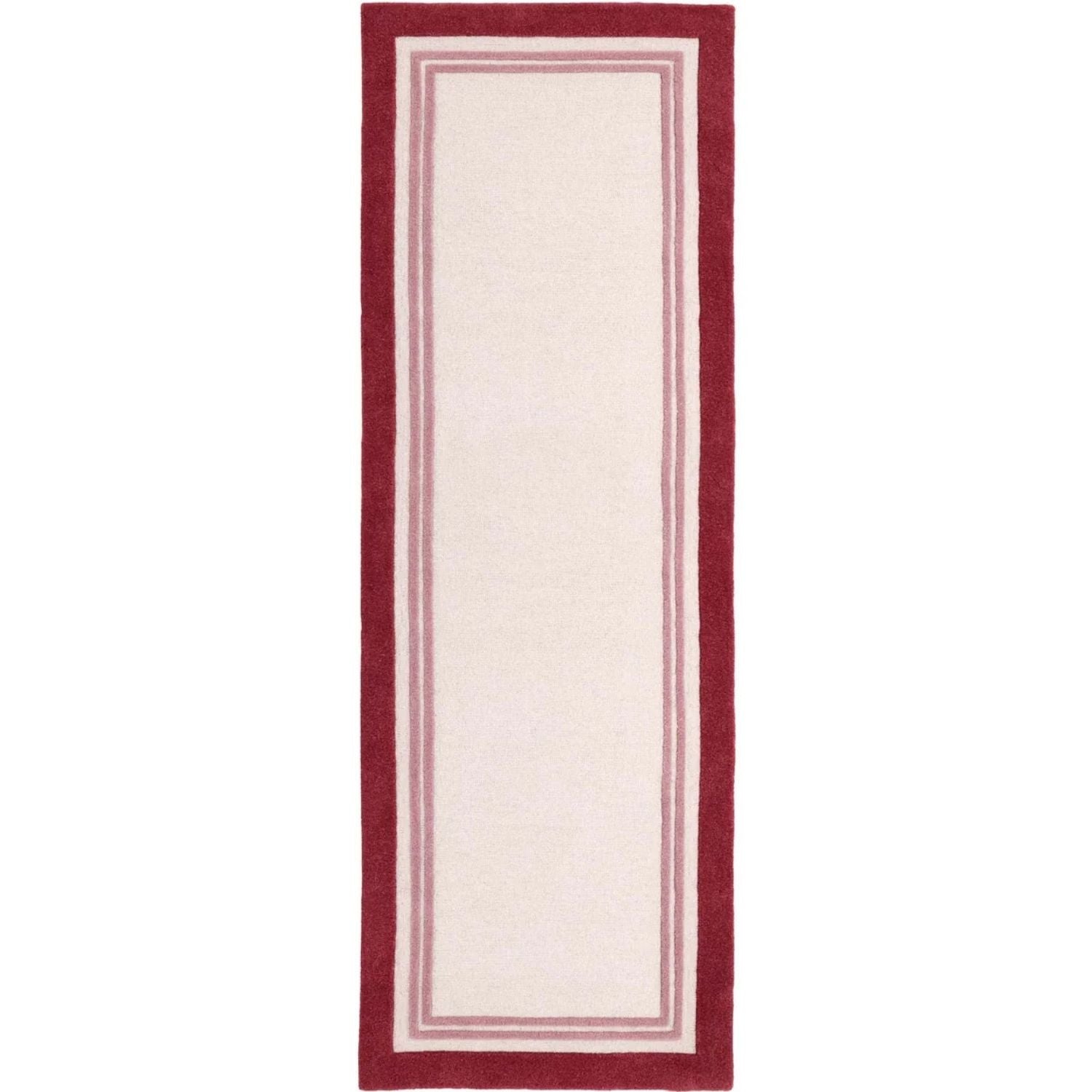 Rectangular rug with a red border on a white background