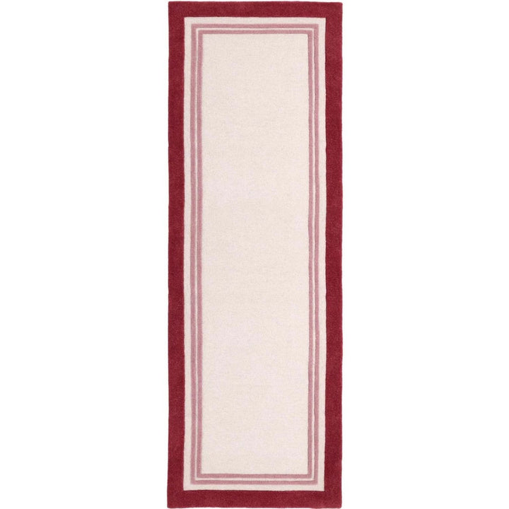 Rectangular rug with a red border on a white background