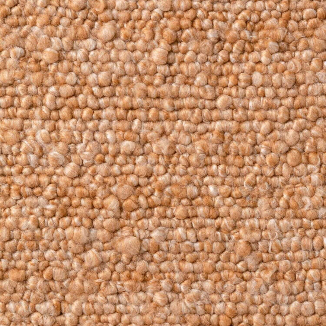 Close-up of beige textured carpet