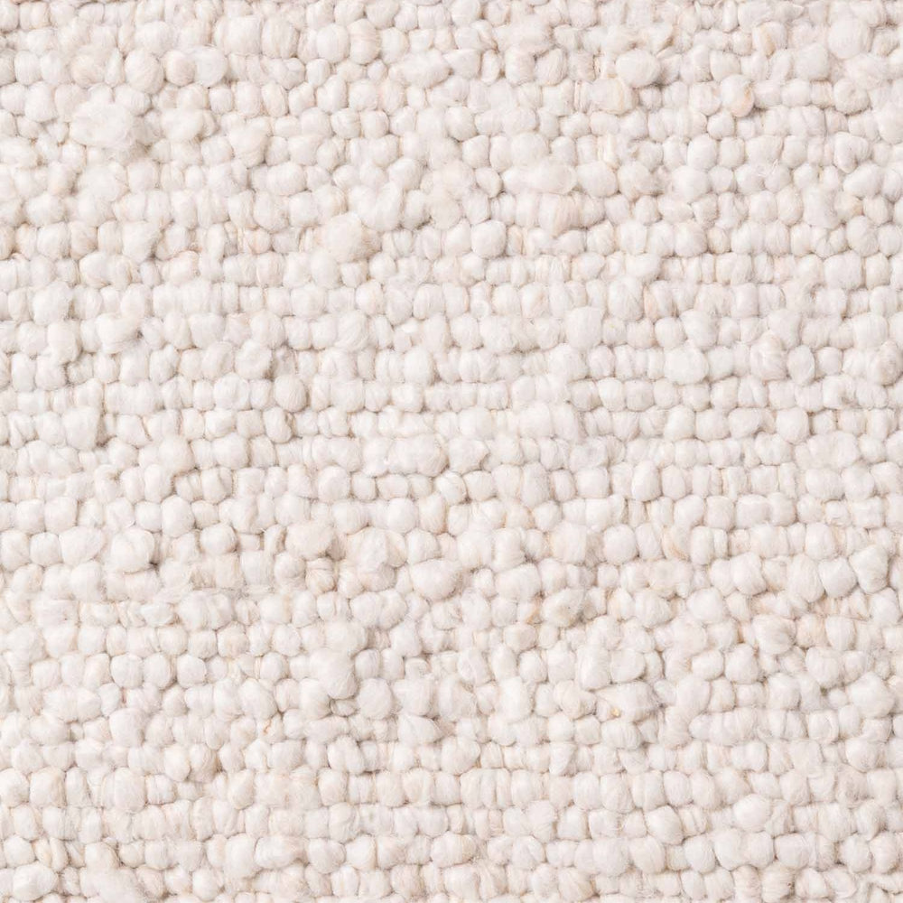 Close-up of a textured beige carpet