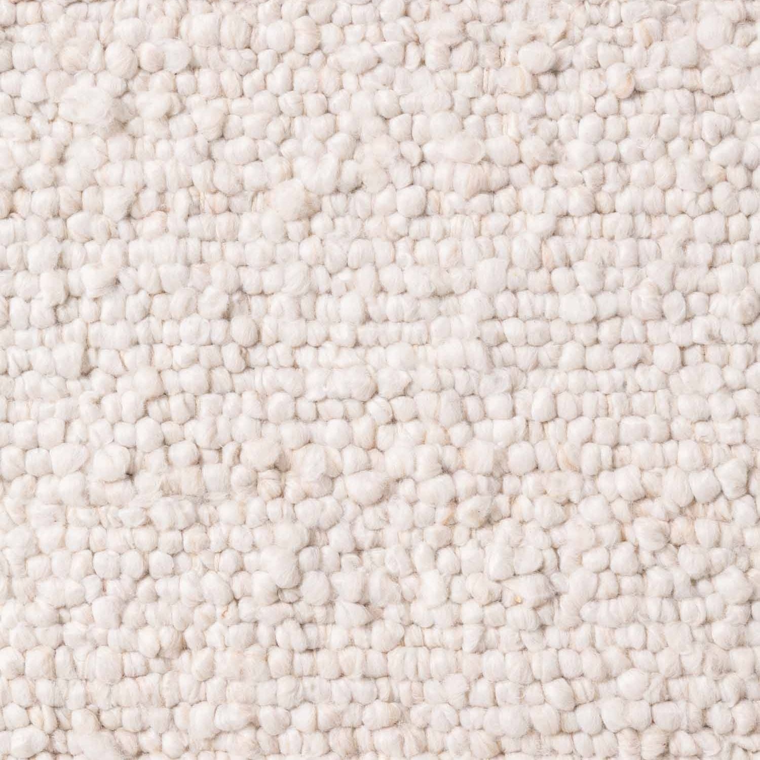 Close-up of a textured beige carpet