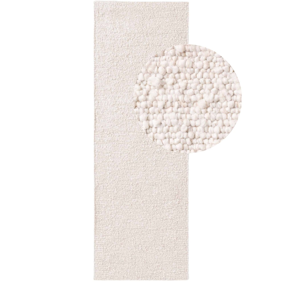 White textured rug with a circular pattern on a white background
