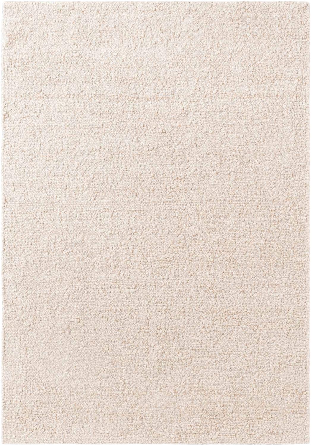 Beige area rug with a textured pattern