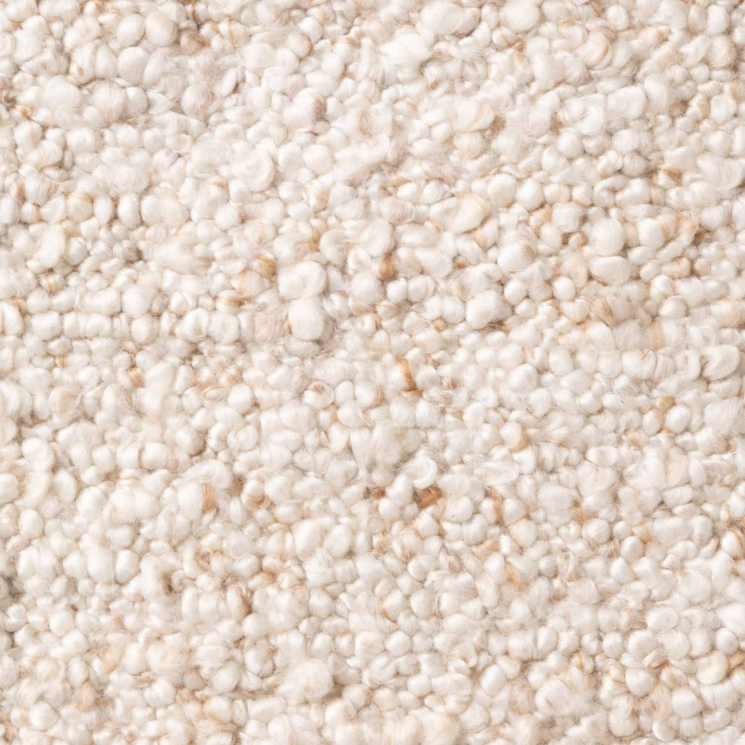 Close-up of a textured beige carpet