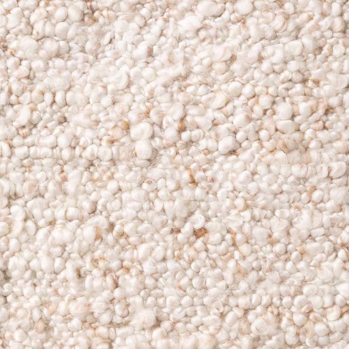 Close-up of a textured beige carpet