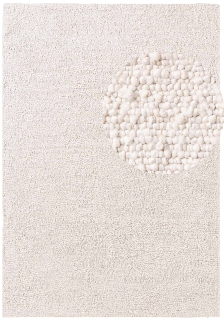 Textured white rug with a circular pattern