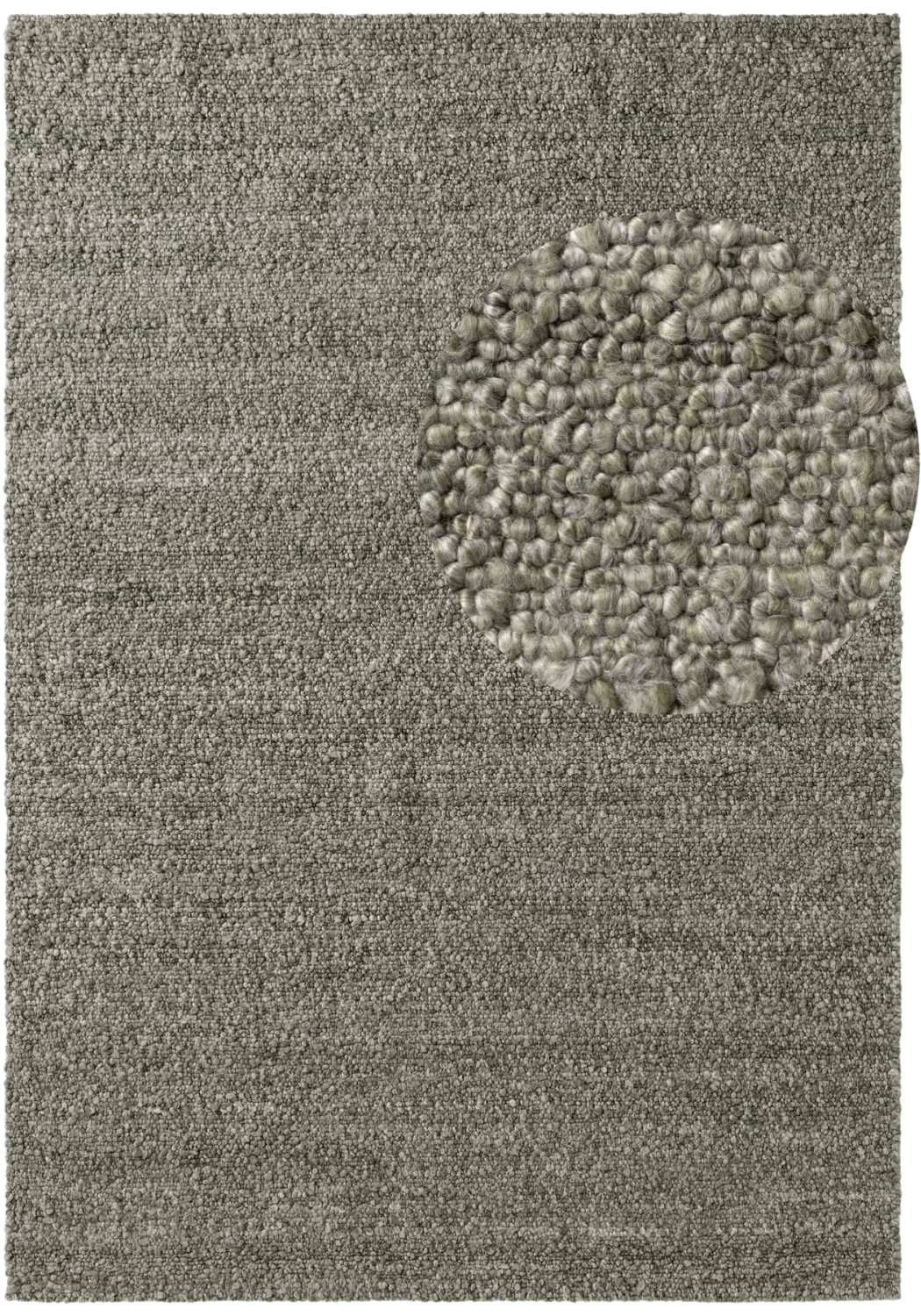 Textured gray rug with a circular pattern