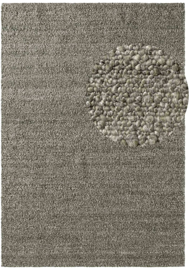 Textured gray rug with a circular pattern