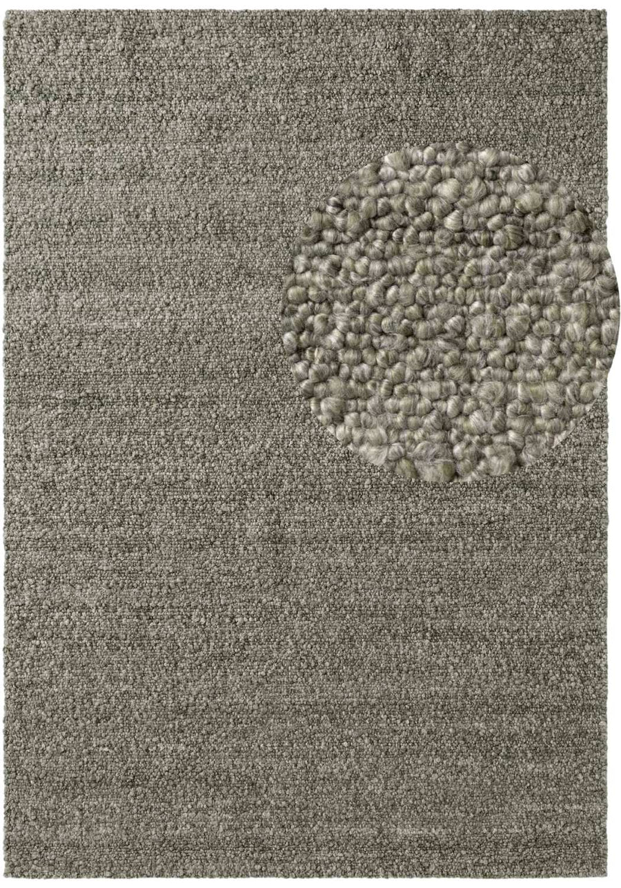 Textured gray rug with a circular pattern