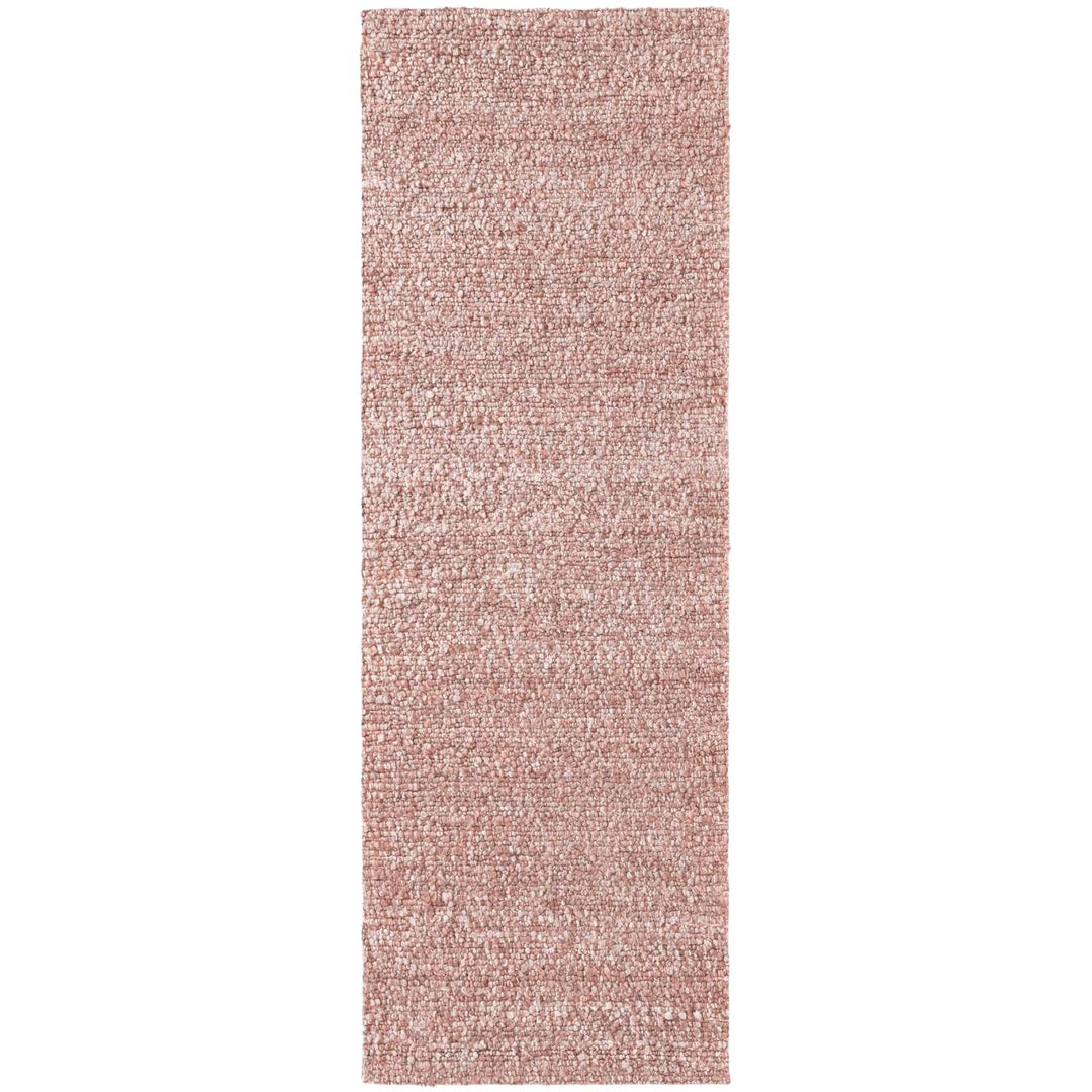 Rectangular pink rug on a white background