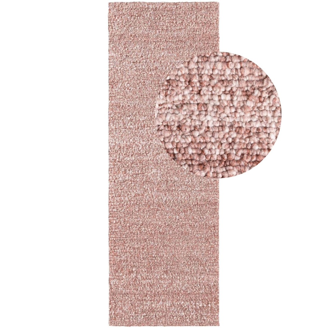 Pink textured rug with a close-up detail on a white background