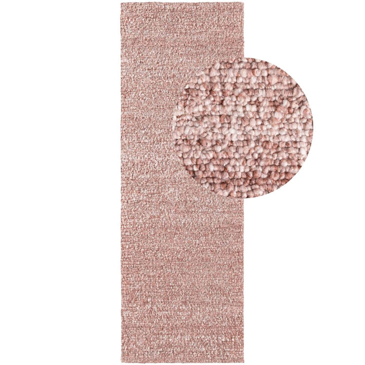 Pink textured rug with a close-up detail on a white background