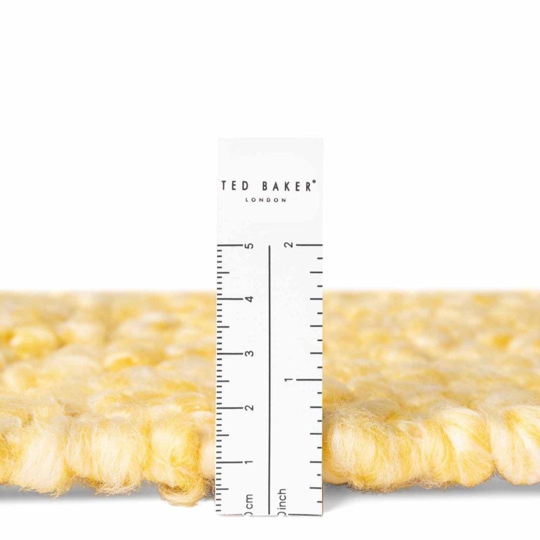 Ted Baker London product with a ruler for scale on a white background