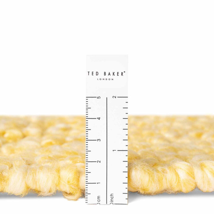 Ted Baker London product with a ruler for scale on a white background