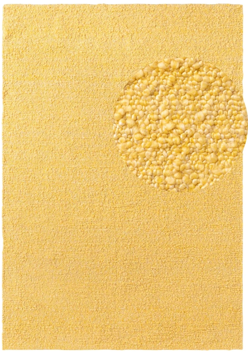 Yellow bath mat with a textured circular design