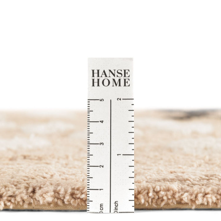 Hanse Home rug with a ruler for scale on a white background