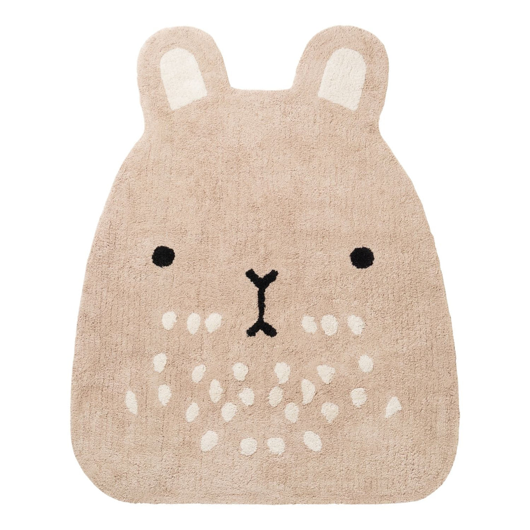 Beige animal-shaped rug with a face design on a white background