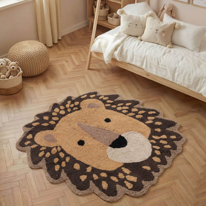 Children's room with a lion-shaped rug on a wooden floor, bed with pillows, and toys.