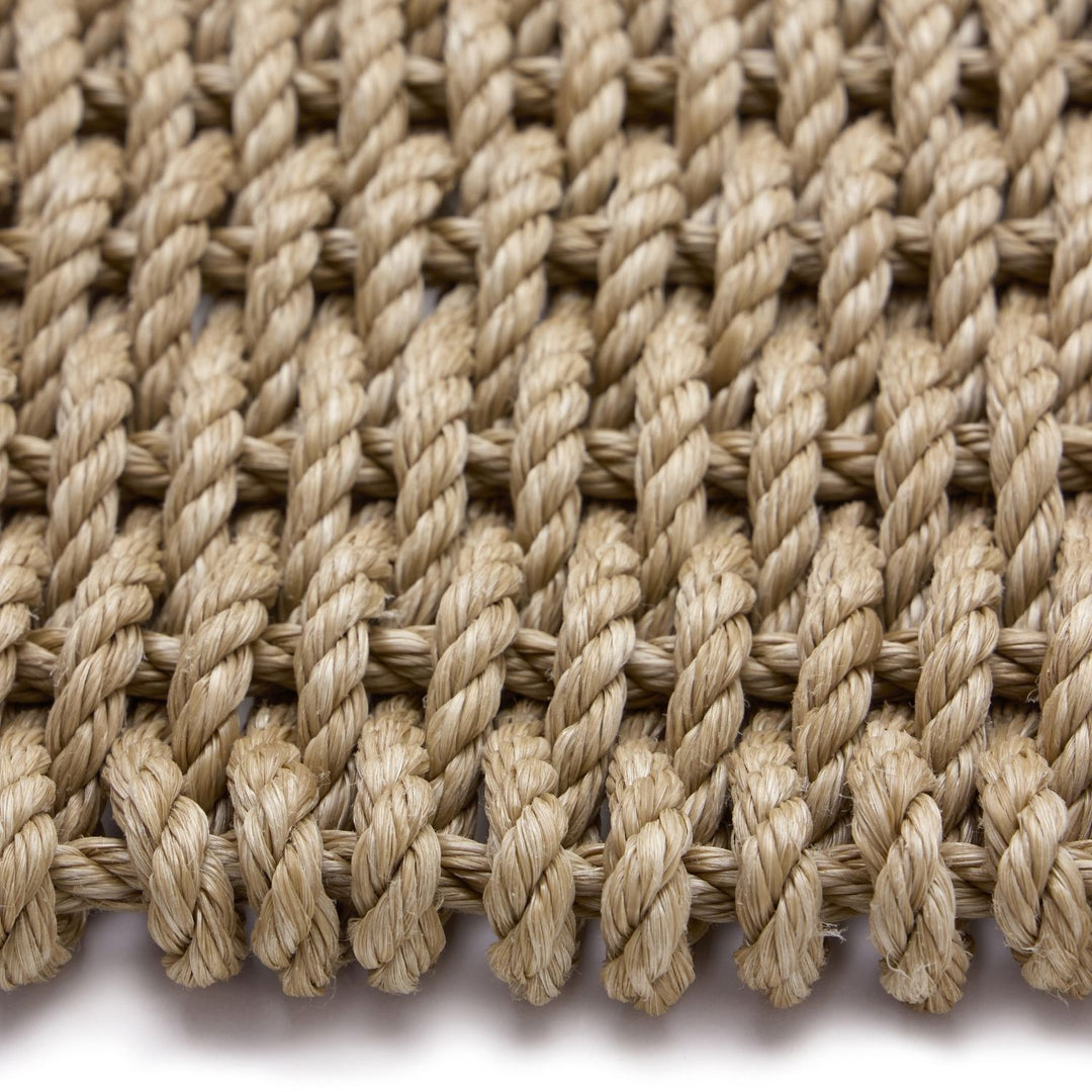 Close-up of braided jute rope on a white background