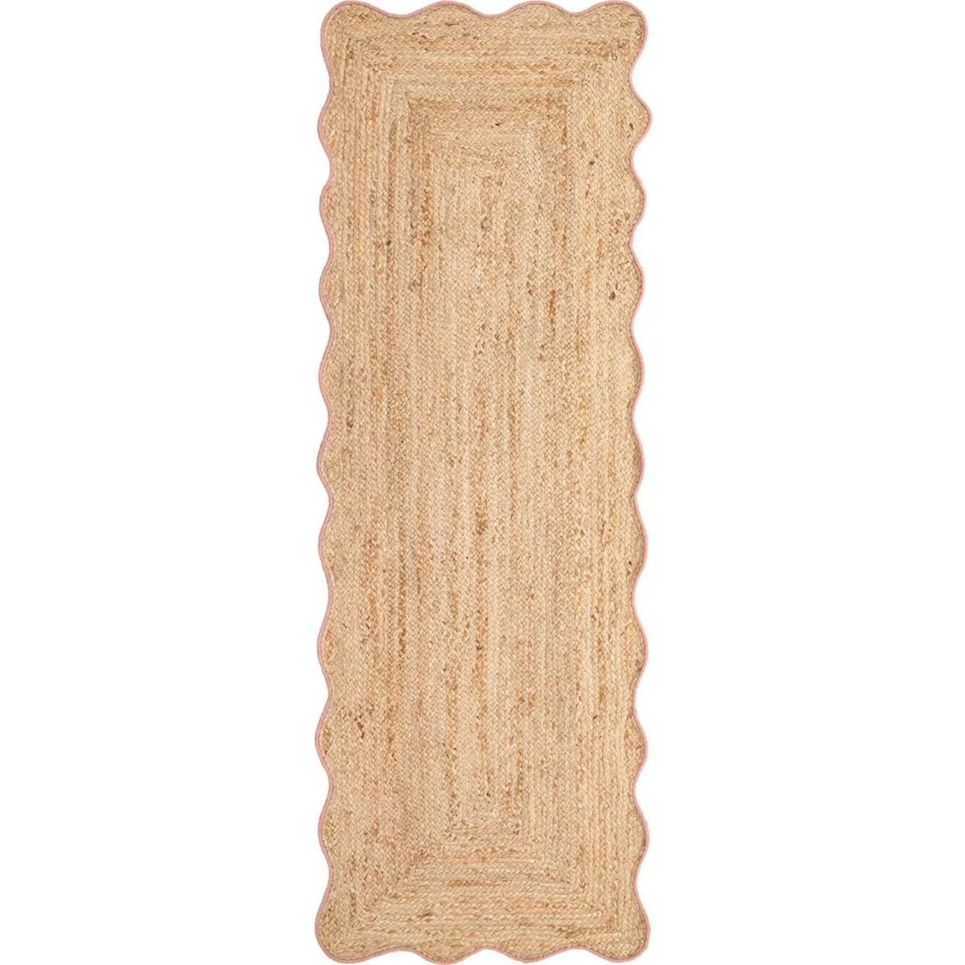Beige braided rug with scalloped edges on a white background