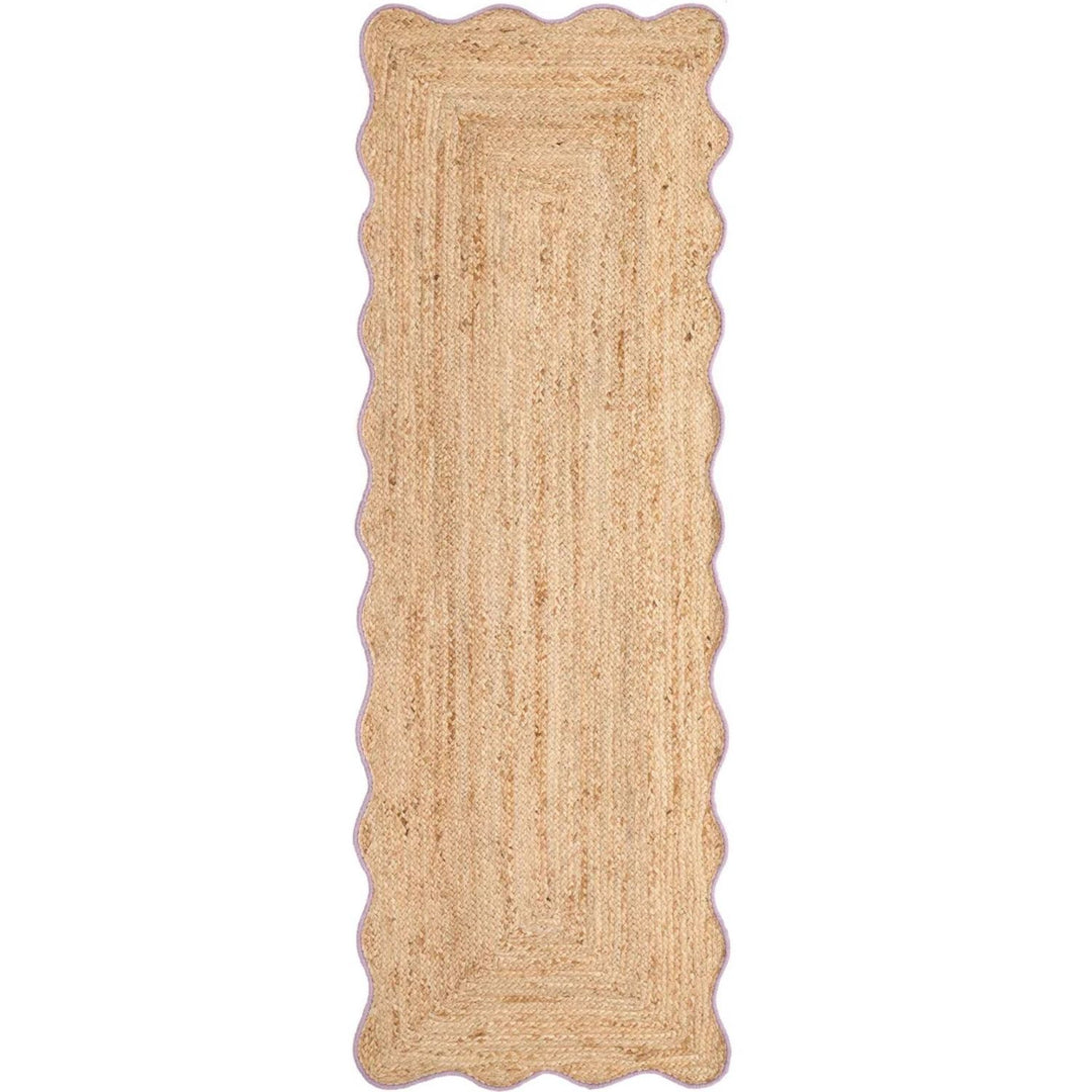 Beige braided rug on a white background