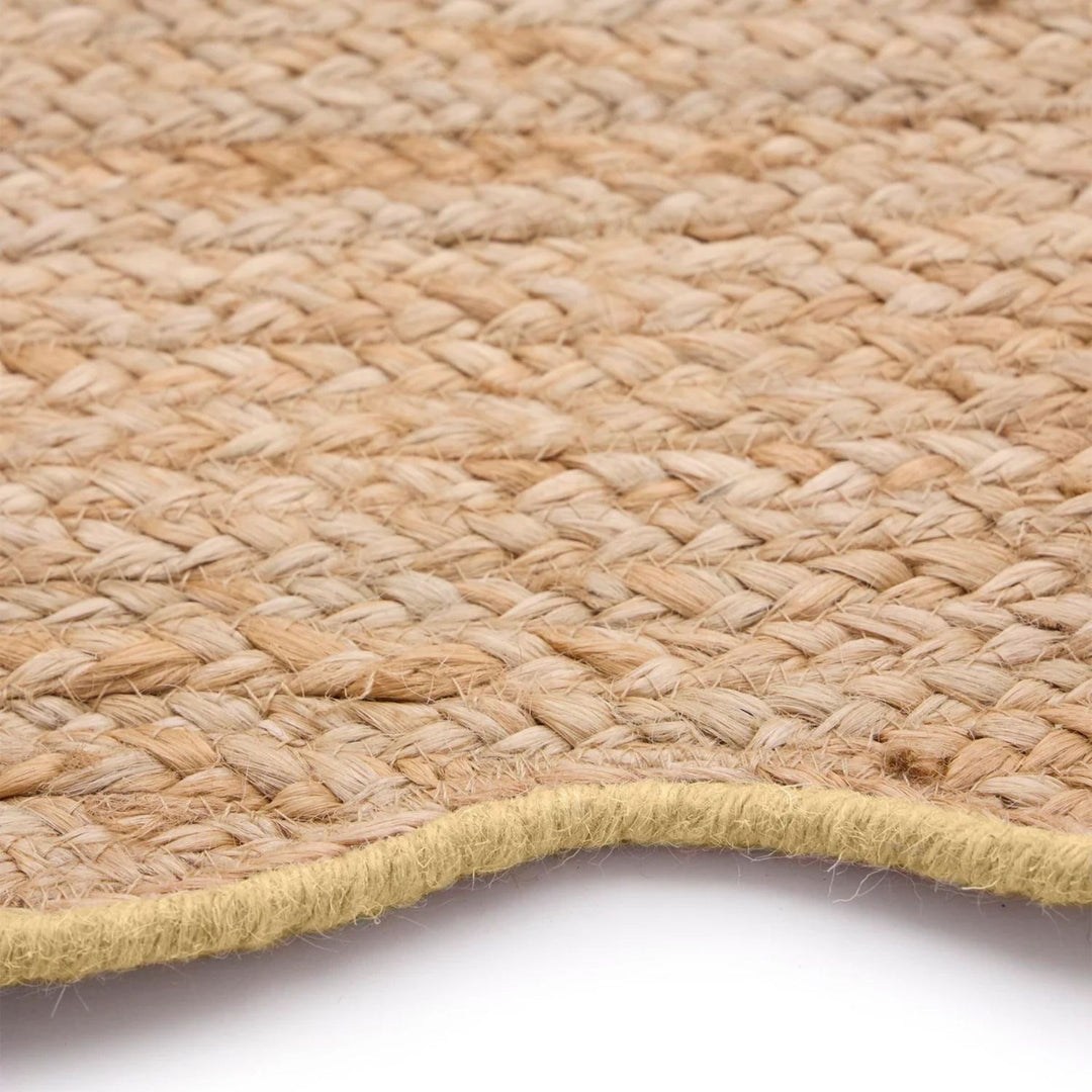 Close-up of a woven natural fiber mat on a white background