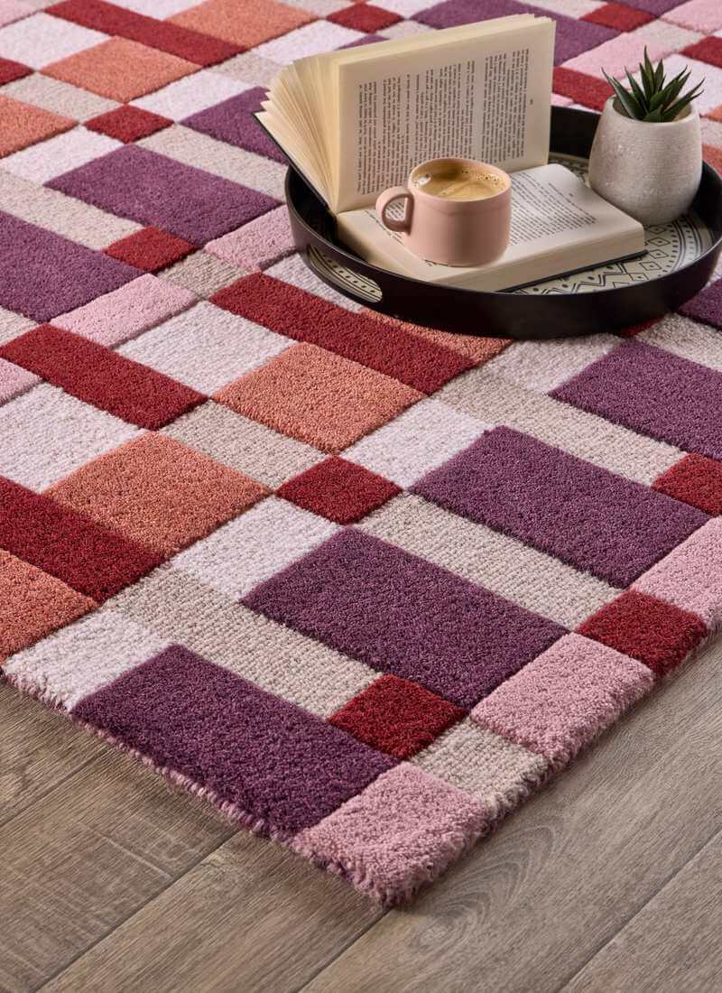 Hand-carved multicolour geometric wool rug with block design, adding texture and style to modern interiors.