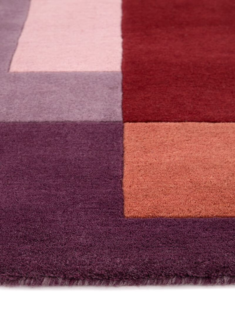 Hand-carved multicolour geometric wool rug showing rich textures and a block design, ideal for modern interiors.