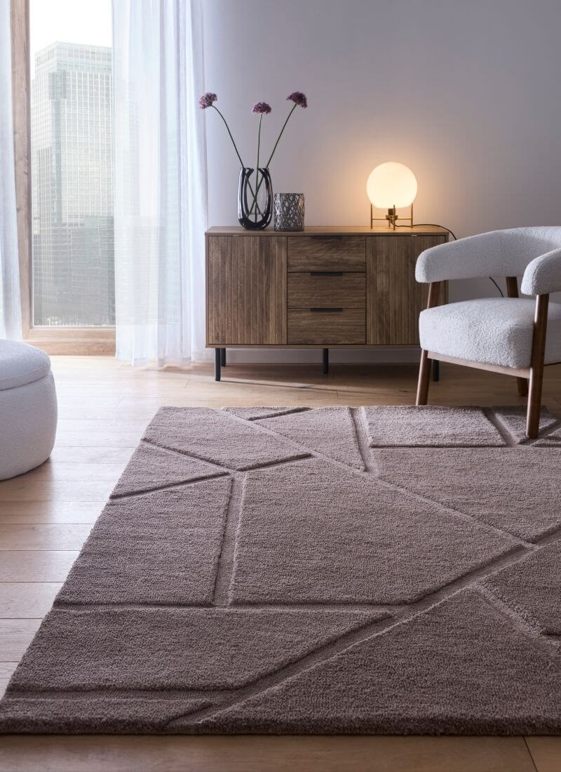 Scandinavian deep pile rug in cream and grey, adding warmth to a modern living room with minimalist decor.