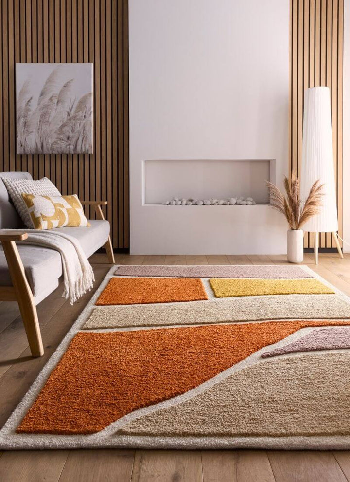 Strata Abstract Rug showcasing warm Terra colors and soft textures in a modern living room setting.