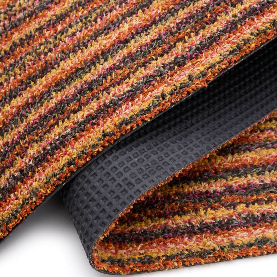 Multicolored textured mat with a black rubber backing