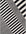 Black and white striped pattern on a textured surface
