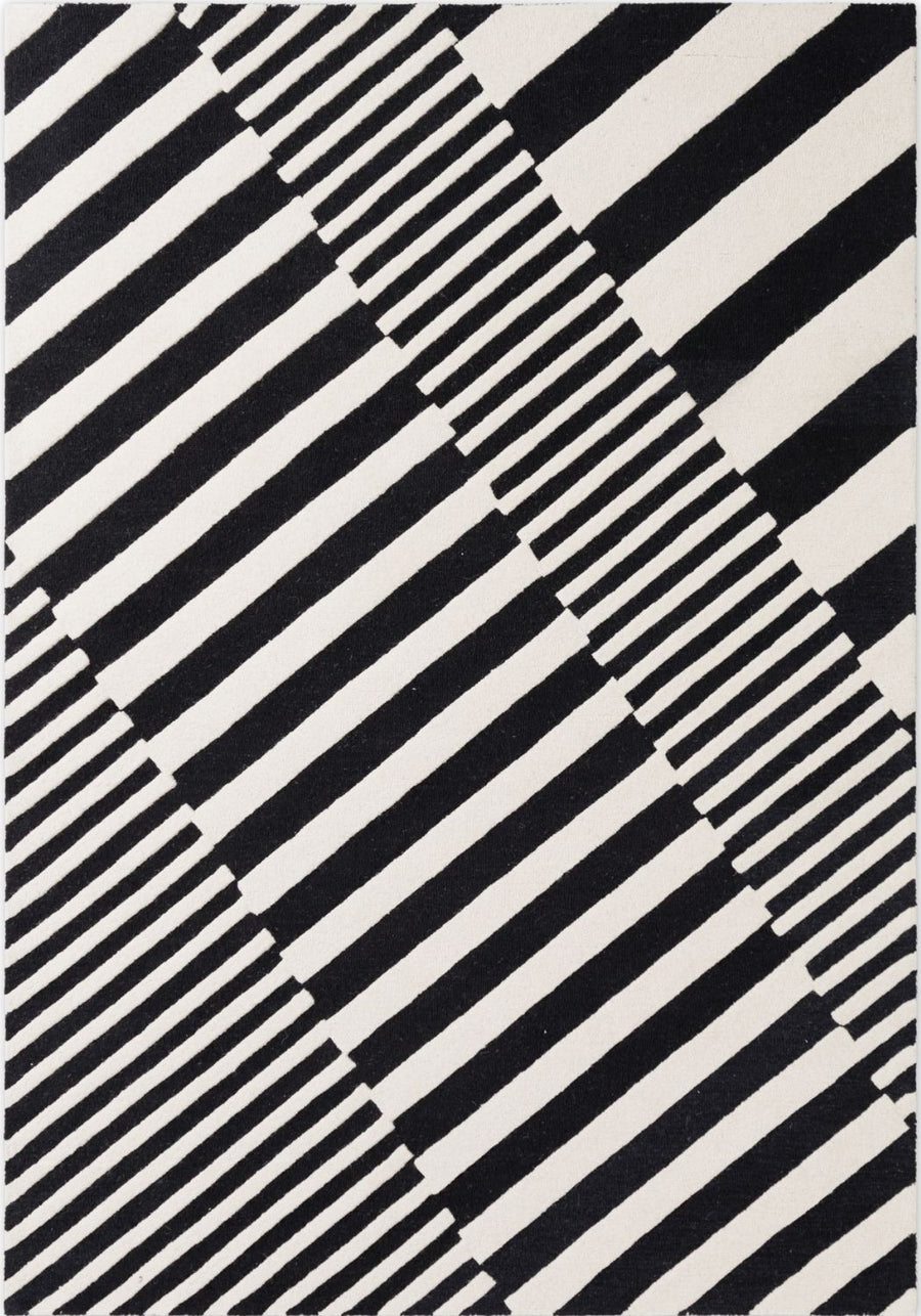 Black and white striped pattern on a textured surface
